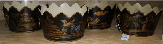 A set of four black and gold toleware style planters
